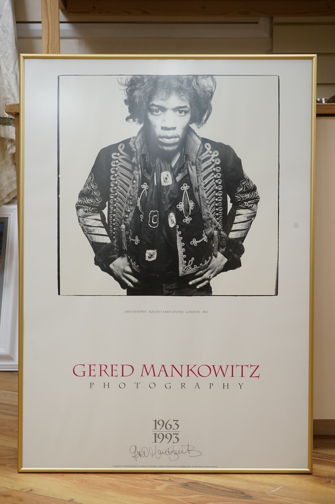 Jimi Hendrix interest; a framed signed poster by Gered Mankowitz of Jimi Hendrix, Mason’s Yard Studio, London, 1967, printed in 1994, signed by Mankowitz at the bottom of the image, 83 x 58.5cm